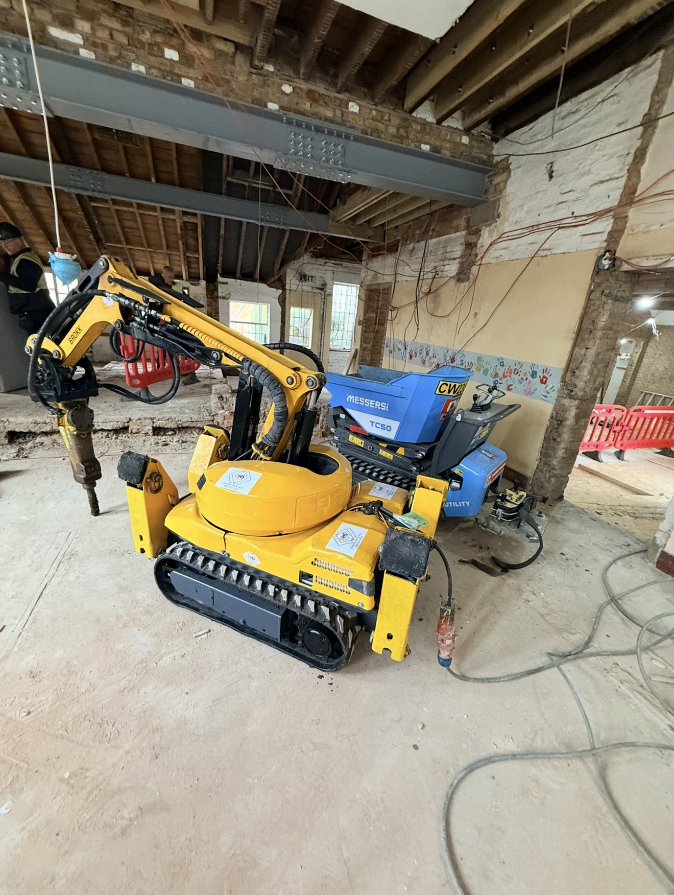 Remote-controlled demolition robot carrying out internal strip-out works at Bishop Stortford
