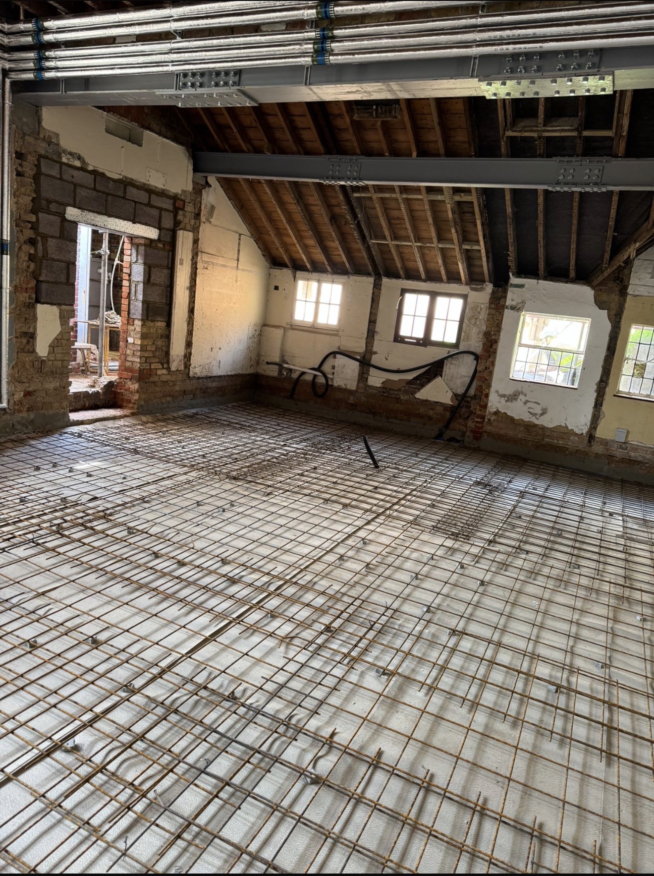 Reinforcement mesh installed over floor insulation ready for concrete works at Bishop Stortford