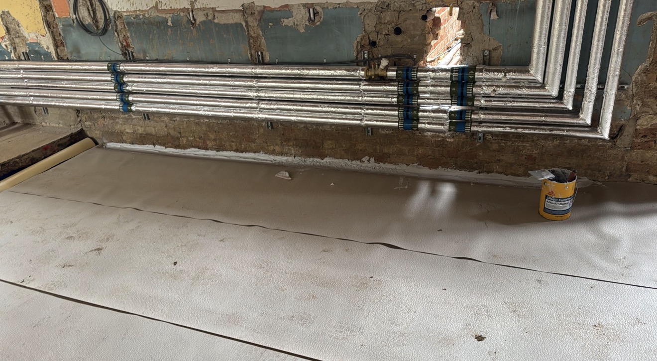 Floor insulation and membrane installation during concrete floor preparation at Bishop Stortford