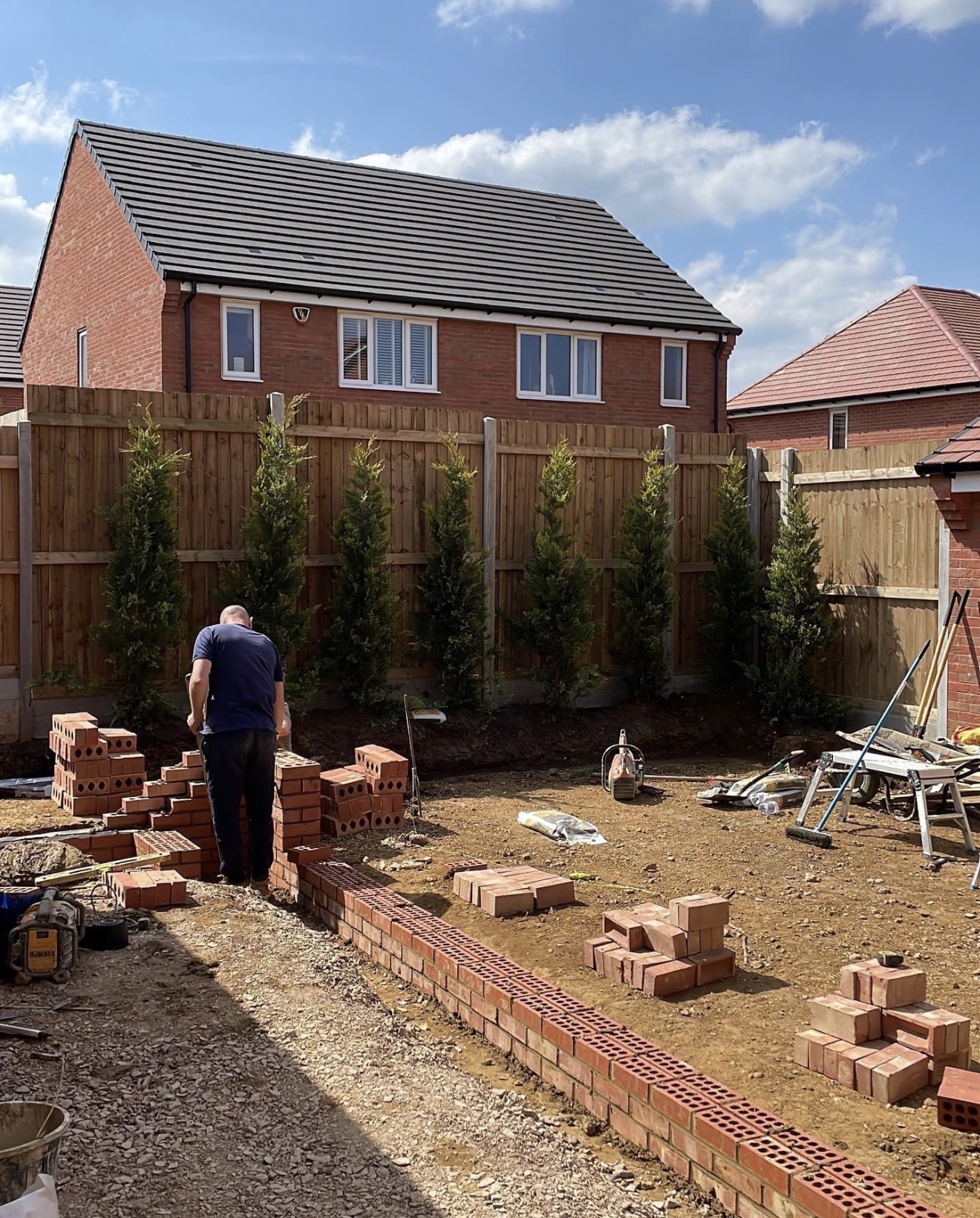Bespoke brickwork planters and walls under construction at Buckton Fields