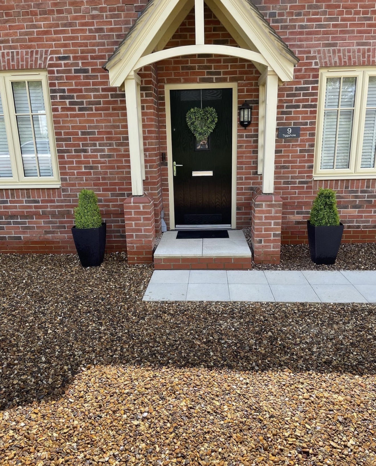 New entrance step with paved approach and gravel surround in Northampton