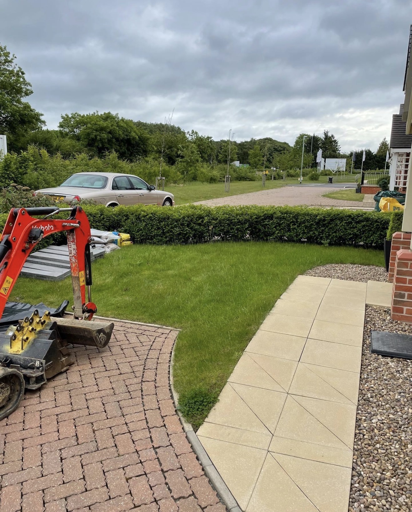 Excavator on site before ground preparation began in Northampton